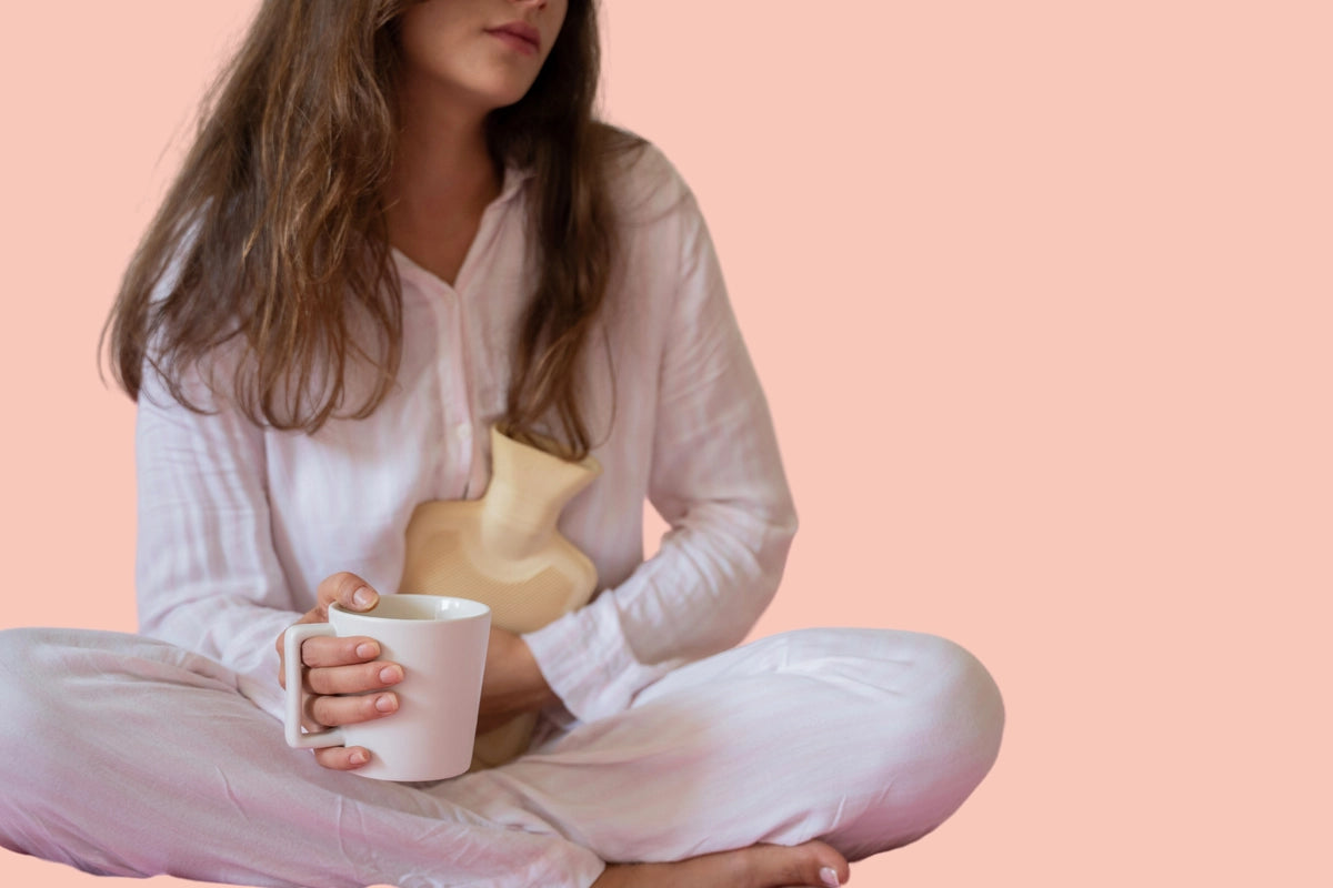 Woman holding a water bottle and tea