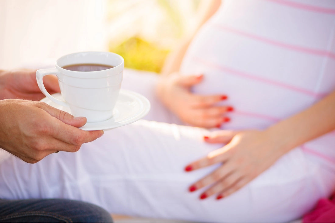 pregnant lady drinking a cup of tea