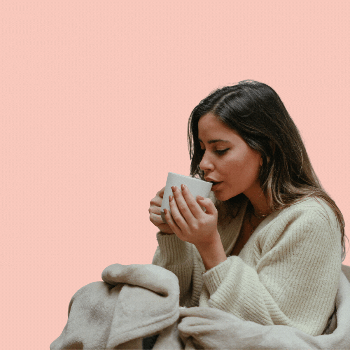 woman drinking tea on pink background